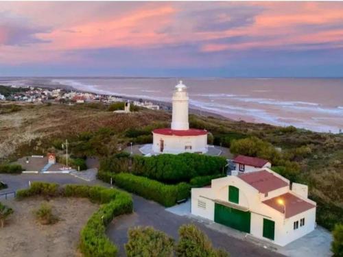 an aerial view of a lighthouse on the beach at Casa Altos del Faro in Viedma