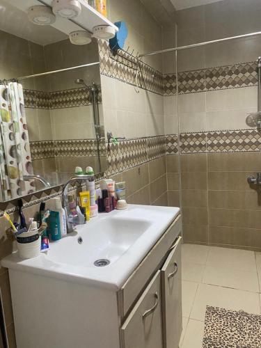 a bathroom with a sink and a shower at Elhafi in Oujda