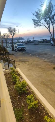 a car parked in a parking lot next to the ocean at istanbul Airport Kumsal Otel in Arnavutköy