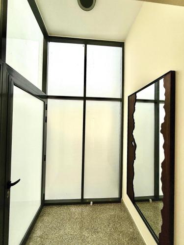 an empty room with sliding glass doors at Lux 3BR Villa, Sea Views & Pool in Sharm