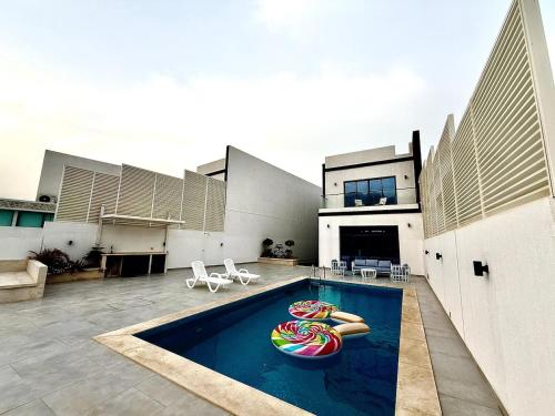 a house with a swimming pool with a swimming poolvisor at Lux 3BR Villa, Sea Views & Pool in Sharm