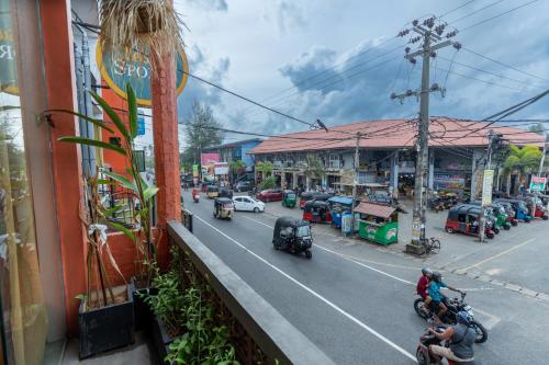 a view of a city street with cars and motorcycles at Land of Joy in Ahangama
