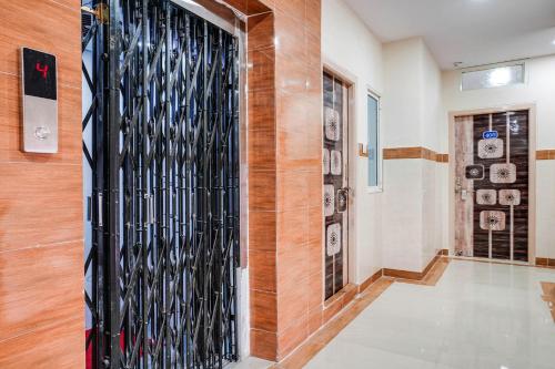 a hallway with a wall of wine bottles at Hotel O Aroma Classic Near Nampally Main Railway station in Hyderabad