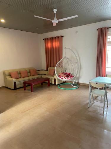 a living room with a couch and a table at The Manor House Kegalle in Utuwankanda