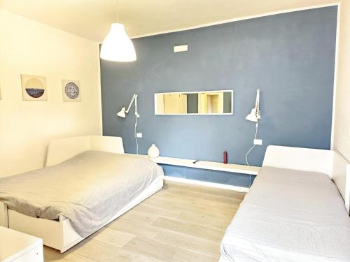 Postel nebo postele na pokoji v ubytování La Corte II