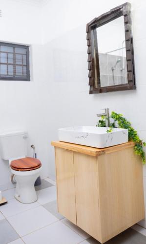 a bathroom with a sink and a toilet at 47 The Heights, Area 47, Sector 1, Lilongwe in Lilongwe