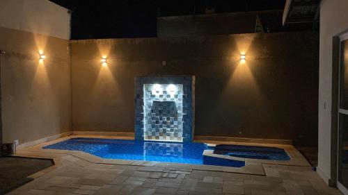 Piscina en o cerca de Casa com Piscina dois quartos com ar um banheiro