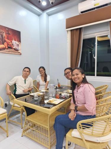 a group of people sitting at a table at Yurich Hotel in Romblon