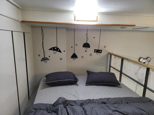 a bedroom with a bed in a small room at Stay in Seoul