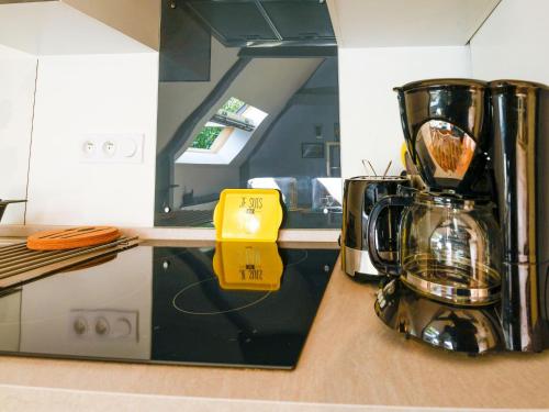 a kitchen with a blender sitting on a counter at Romantic Escape in Normandy in Isigny-sur-Mer