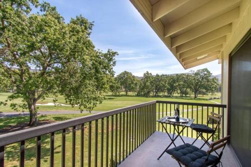 a patio with a table and chairs on a balcony at The Napa Residences in Napa