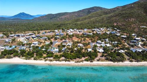 an aerial view of a resort on a beach at Tranquillity by the Sea in Hideaway Bay