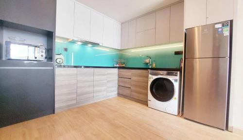 Kuchyň nebo kuchyňský kout v ubytování Sweet Home - Homestay apartment system at Citadines Marina Ha Long building