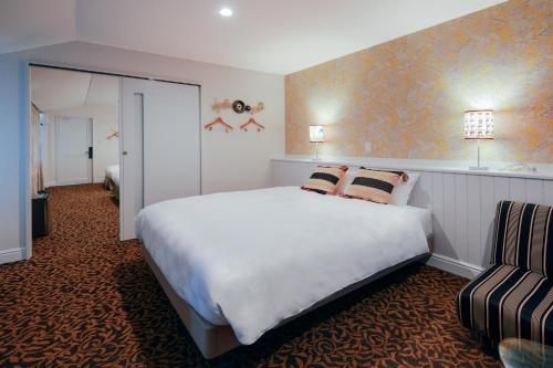 Postel nebo postele na pokoji v ubytování Hotel Wellies