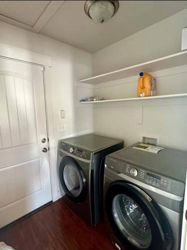 a washer and dryer in a small room at Pet-Friendly 5BR Near Hospital & TRAX with Projector in Murray
