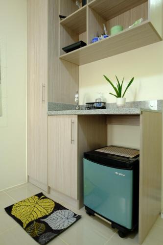 Kuchyň nebo kuchyňský kout v ubytování Cecils Cubao Cozy Escape