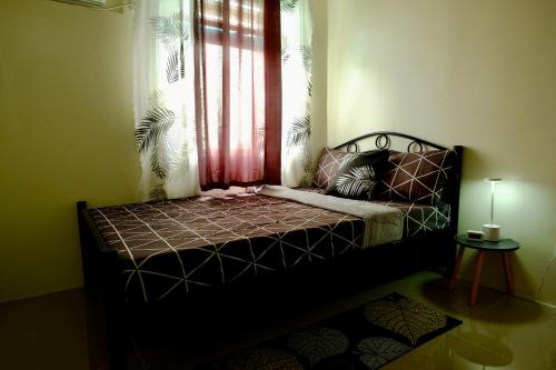 Postel nebo postele na pokoji v ubytování Cecils Cubao Cozy Escape