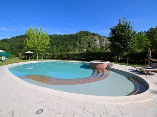 a large swimming pool in a patio at Apartment in Marche with Pool & Terrace in Apecchio