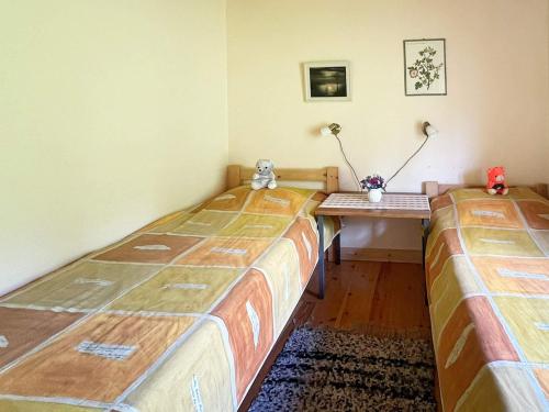 a room with two beds and a desk with two lamps at 4 person holiday home in BRAÅS-By Traum in Braås