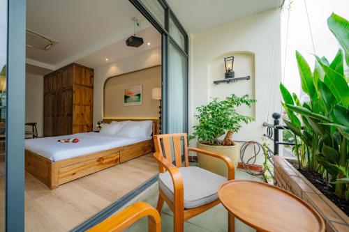 Ένα ή περισσότερα κρεβάτια σε δωμάτιο στο TH Saigon Boutique