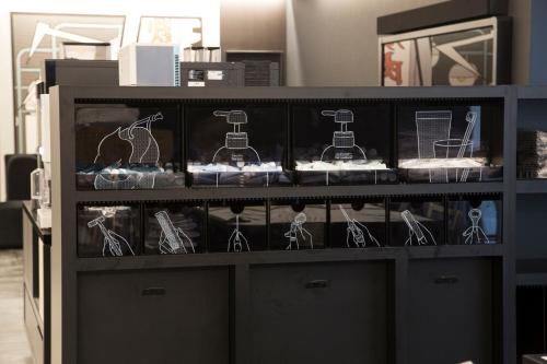 a display cabinet with a bunch of glasses on it at HOTEL TAVINOS Hamamatsucho - Vacation STAY 51014 in Tokyo