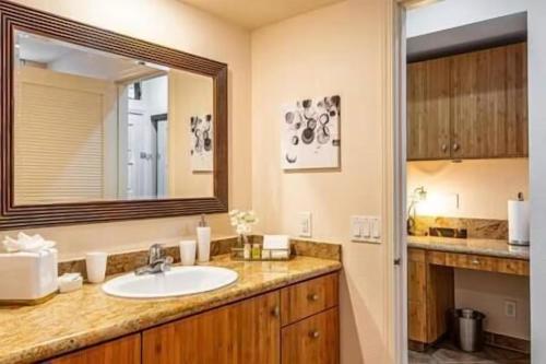 a bathroom with a sink and a mirror at Premier Collection at Grand Champions Wailea - Limited-Time Half Off in Wailea