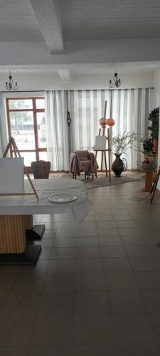 a living room with a couch and a table at Gospodarstwo Agroturystyczne Bogdanówka in Rossosz