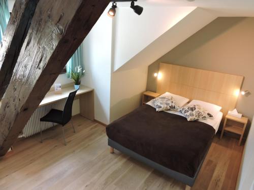 Postel nebo postele na pokoji v ubytování Auberge Communale de St-Légier