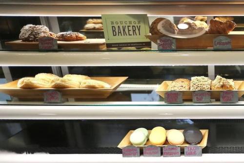 a display case in a bakery with different types of pastries at The Napa Residences in Napa
