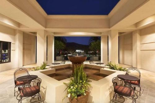 a patio with a fountain in the middle of a building at The Napa Residences in Napa