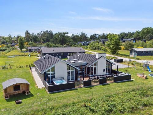 an aerial view of a house with a yard at 5 star holiday home in Glesborg in Glesborg
