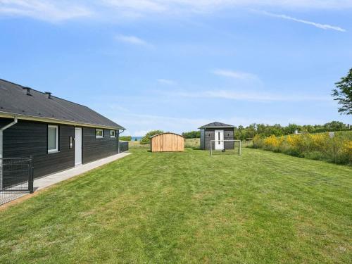 a yard with a house and a shed at 5 star holiday home in Glesborg in Glesborg