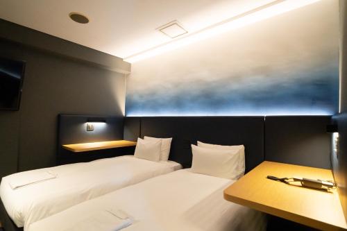 Katil atau katil-katil dalam bilik di Hotel New Shohei