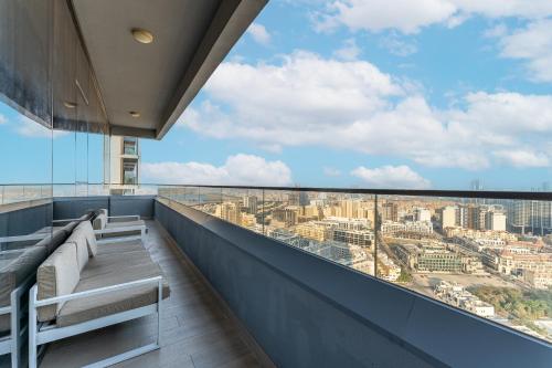 a balcony with a view of a city at HAVN - 2 Bedroom Apartment in Bloom Tower, JVC in Dubai