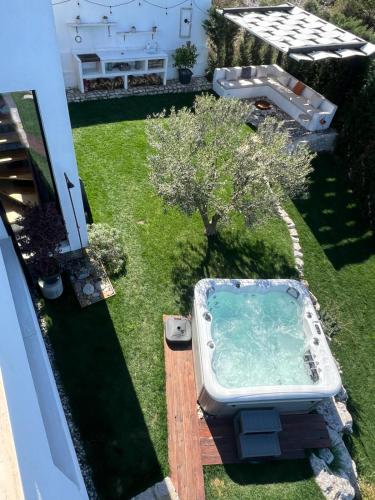 an aerial view of a bath tub in a yard at Lake Breeze Villa with a Pool & Magnificent Views in Široka