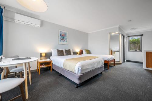Postel nebo postele na pokoji v ubytování Comfort Inn The Pier