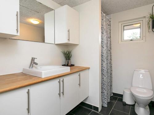 a bathroom with a sink and a toilet at Luxury Retreat with Pool - By Traum Ferienwohnungen in Ho