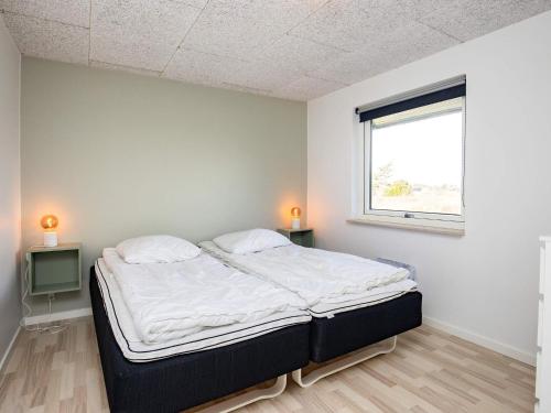 a large bed in a room with a window at Luxury Retreat with Pool - By Traum Ferienwohnungen in Ho