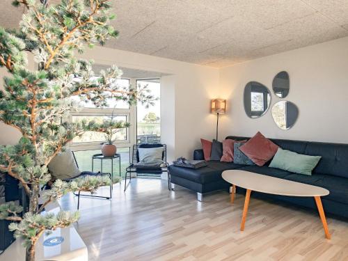 a living room with a couch and a christmas tree at Luxury Retreat with Pool - By Traum Ferienwohnungen in Ho