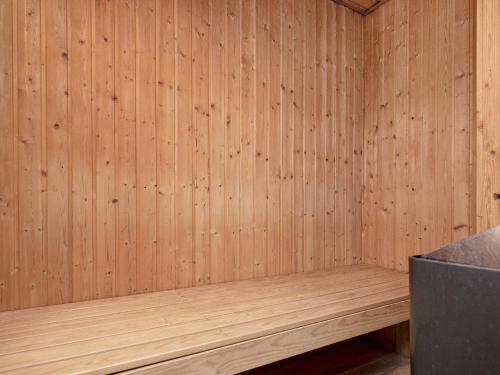 a wooden sauna with a wood paneled wall at Luxury Retreat with Pool - By Traum Ferienwohnungen in Ho