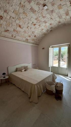 Postel nebo postele na pokoji v ubytování Villa Itriò - In the heart of Apulia - B&B - pool - rural experience
