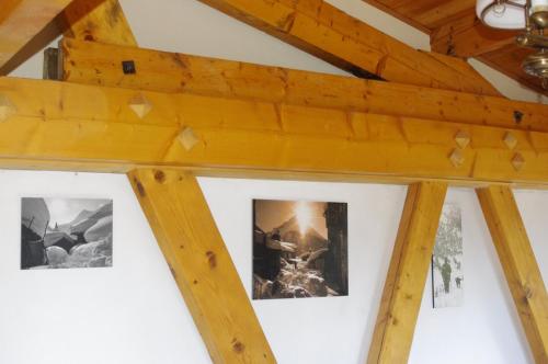 a room with three pictures on the ceiling at Central Hostel Chatel in Châtel