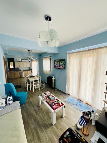 a living room with a couch and a table at Villa Christoforos Kekakos Magical View in Neapolis