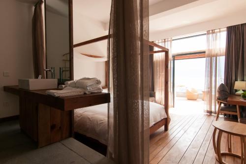 Postel nebo postele na pokoji v ubytování Manwu Dali Jimu Boutique Guesthouse