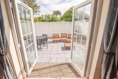 a view of a patio from the window of a house at Corner Cottage in Castlerock