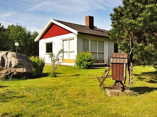 a small white house with a red roof at 5 person holiday home in GLOMMEN-By Traum in Glommen