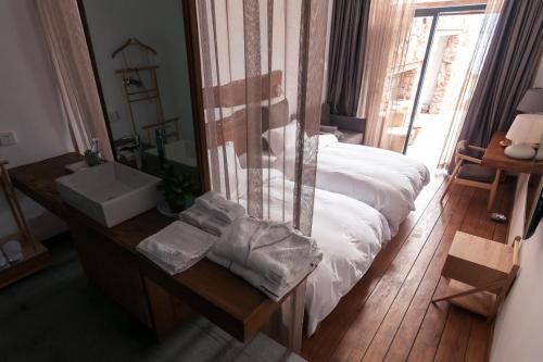Postel nebo postele na pokoji v ubytování Manwu Dali Jimu Boutique Guesthouse