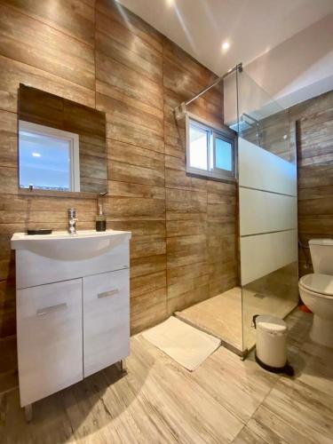 a bathroom with a sink and a toilet at 1-bedroom duplex 100m by the sea in Limassol