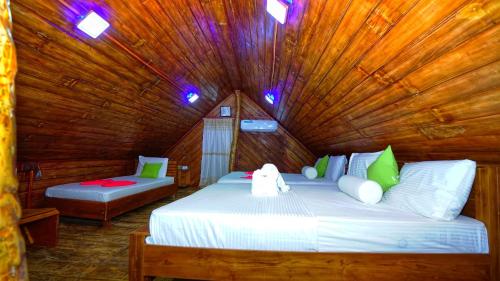 Postel nebo postele na pokoji v ubytování Lion Rock Haven Cabana