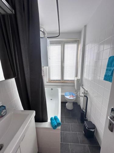a bathroom with a toilet and a sink at Ecostay Al Porto in Münster